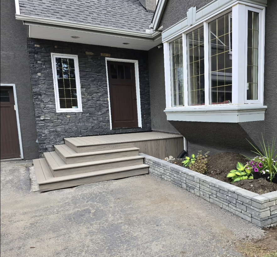 Complex landscaping project featuring retaining walls and integrated deck