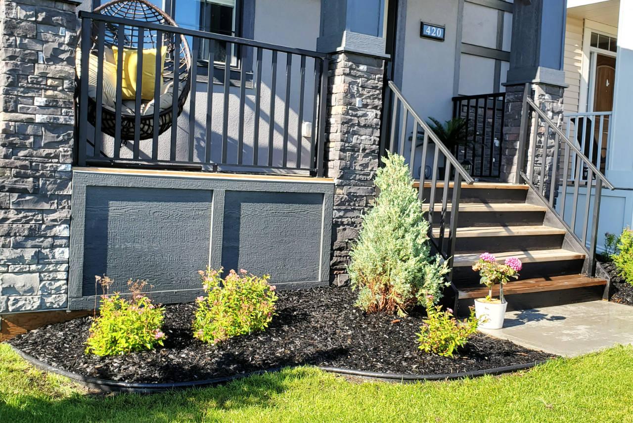 Outdoor living space enhanced with carefully selected trees and plantings