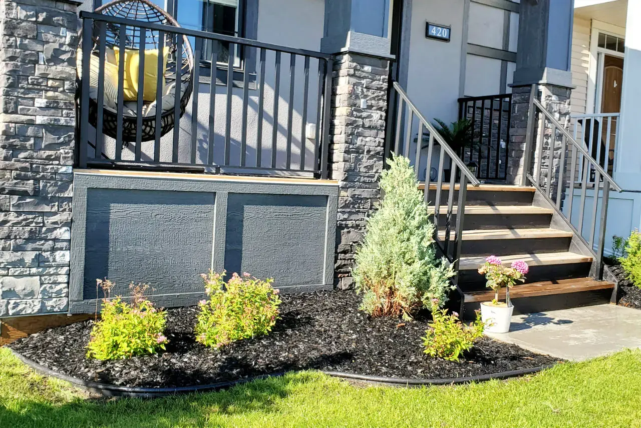 Outdoor living space enhanced with carefully selected trees and plantings