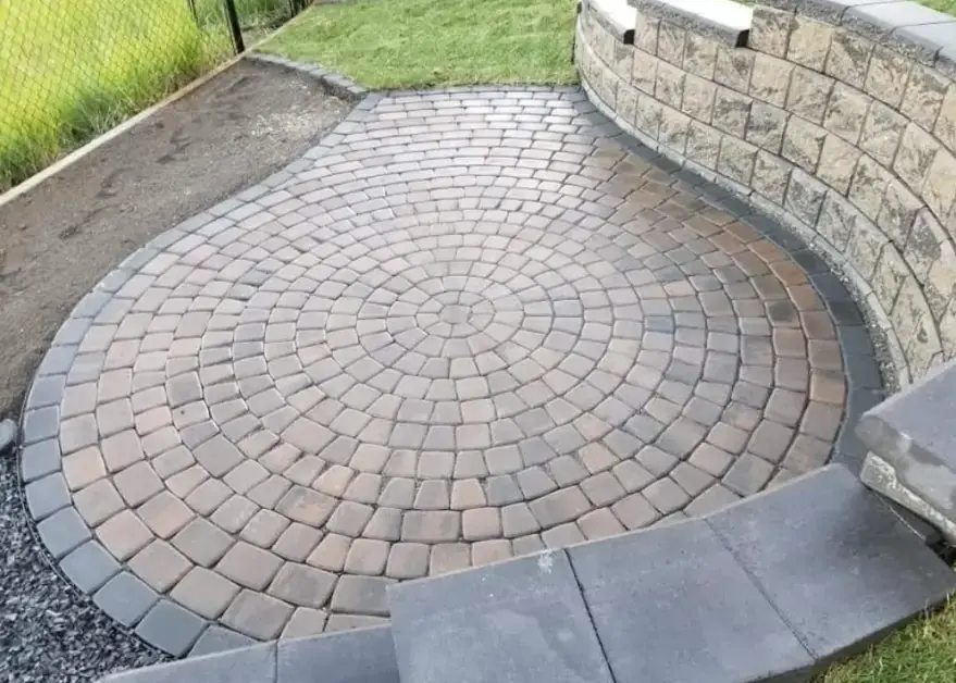 Stone paver patio with basket weave pattern and contrasting border