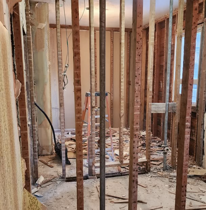 Demolition equipment clearing space for new landscape installation